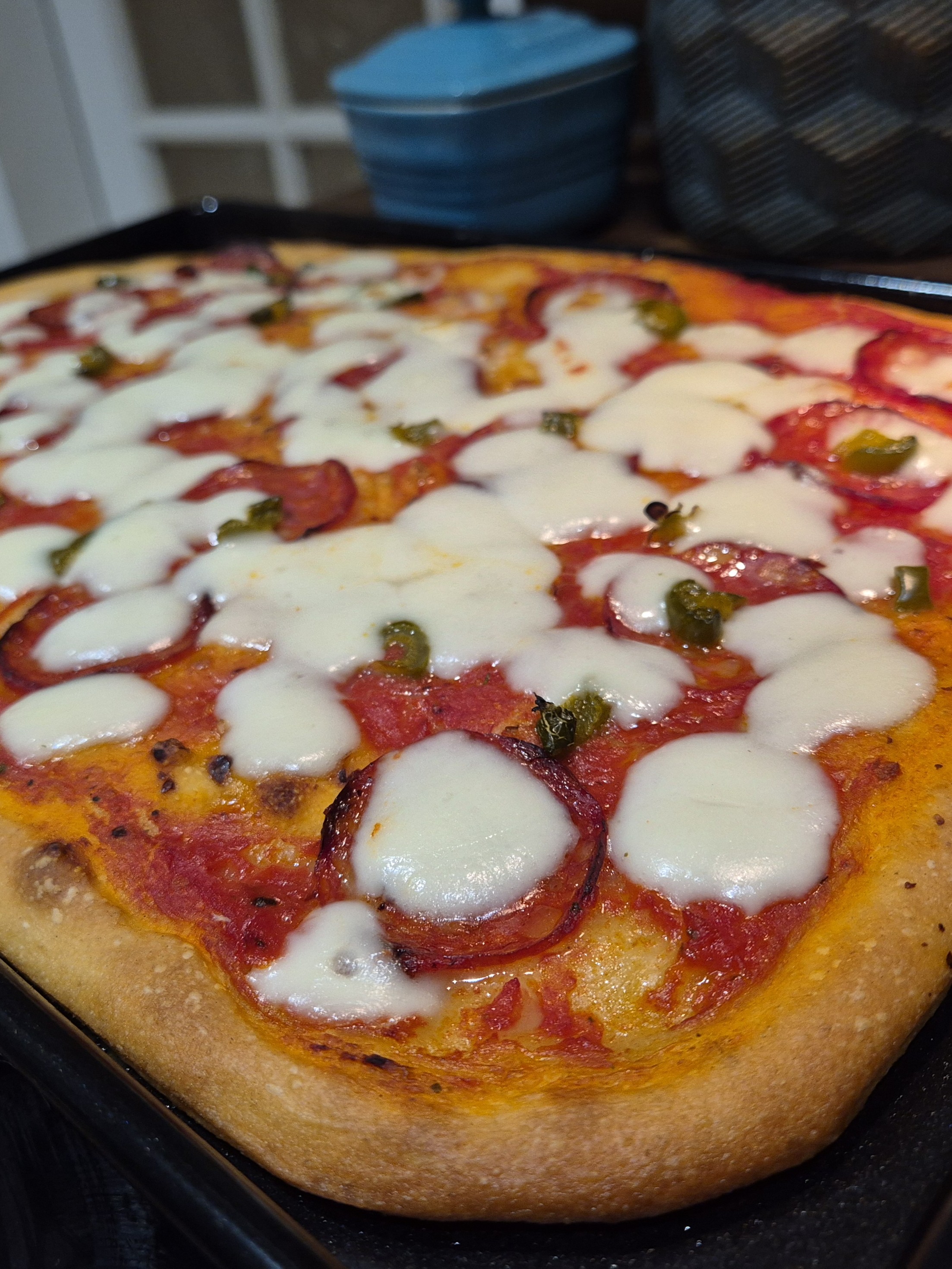 Pizza al taglio (Roman style pizza) on a baking tray